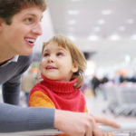 Father and daughter in shop